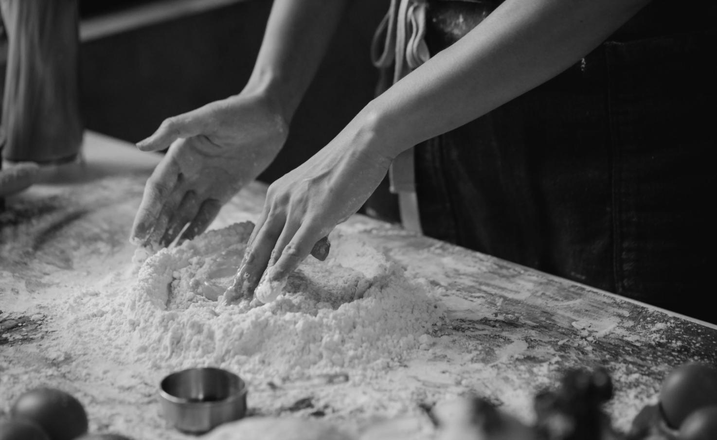 Professional culinary training environment with modern kitchen equipment and learning spaces