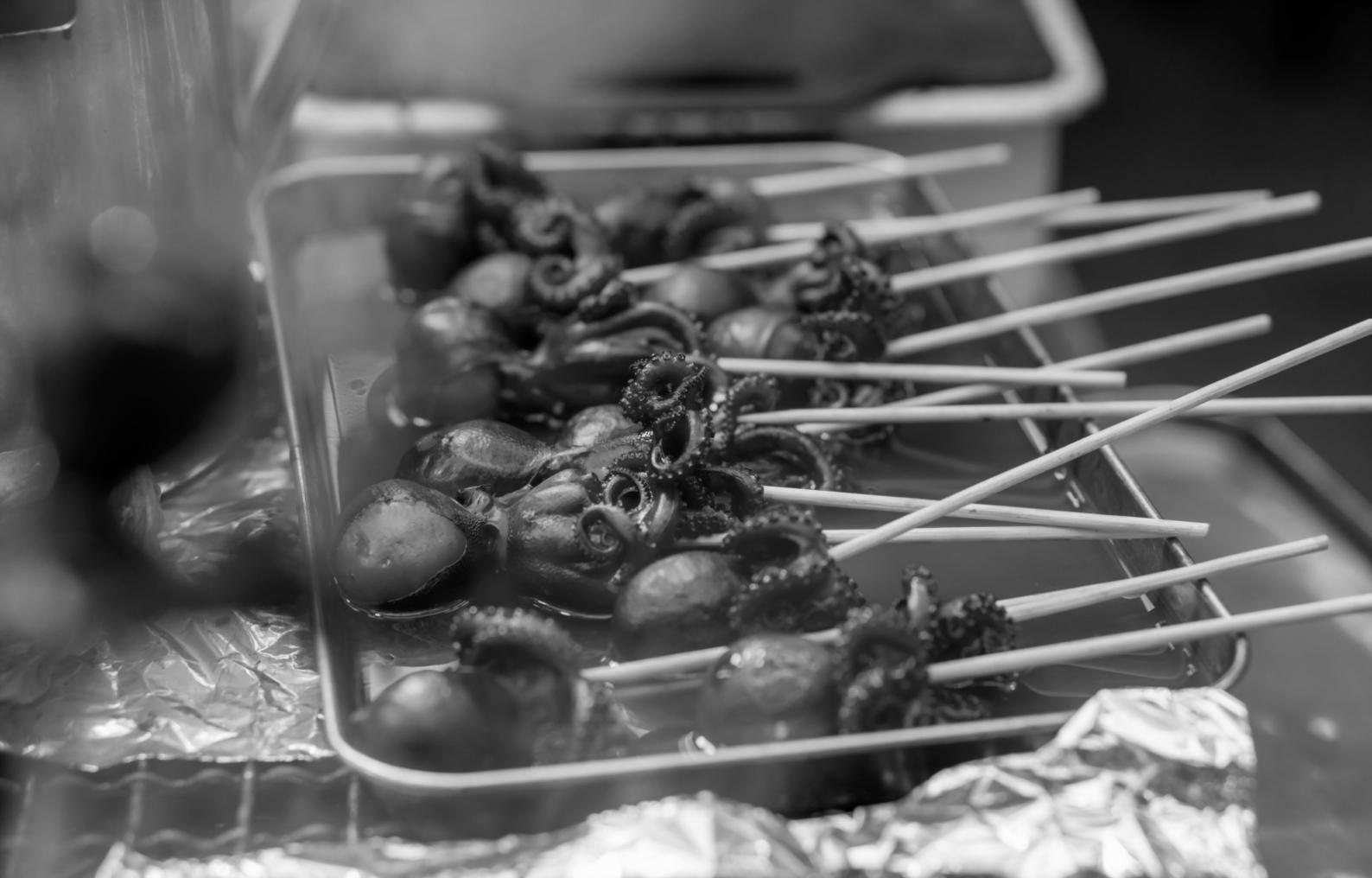 Professional culinary workspace with fresh ingredients and cooking tools